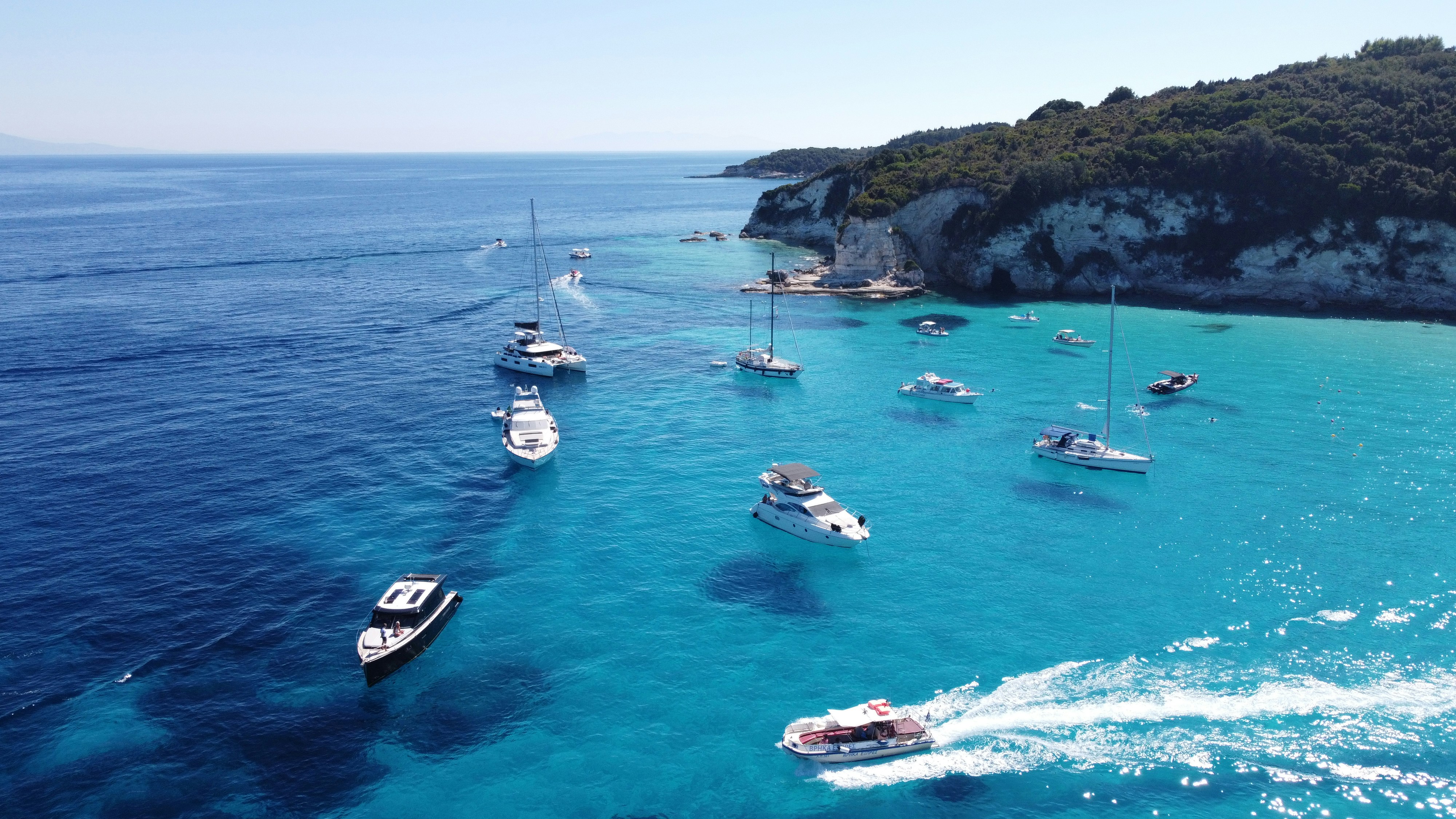 a few boats were captured from the sky close to paxos island paxos пакс