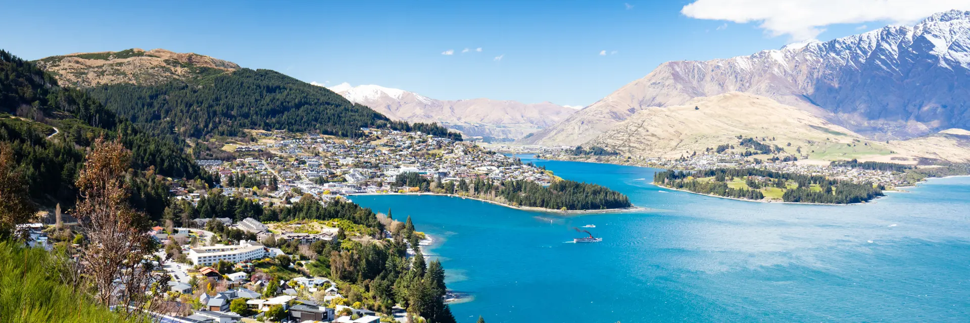 1 a view of queenstown on a sunny spring day in new zealand