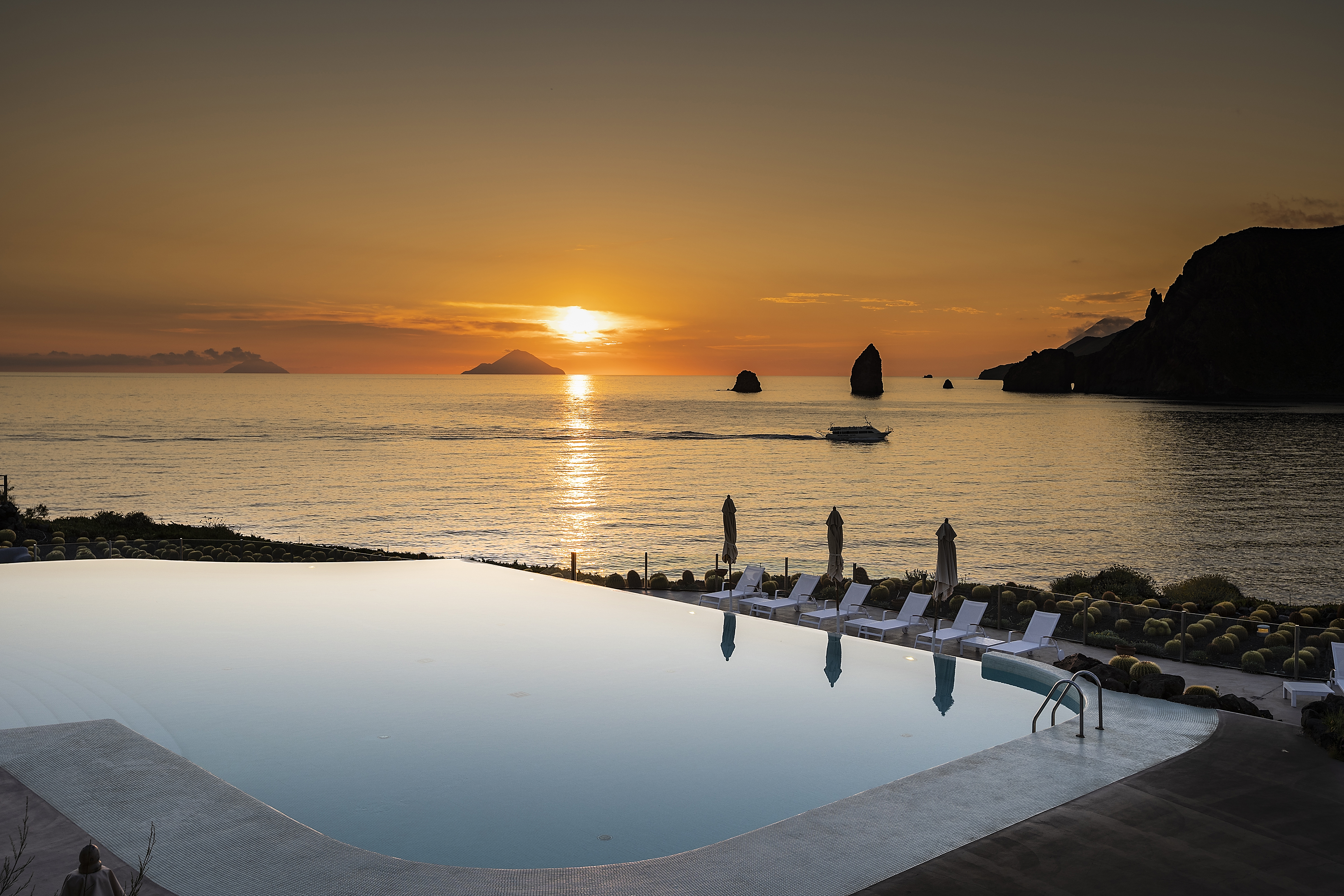 infinti pool at sunset
